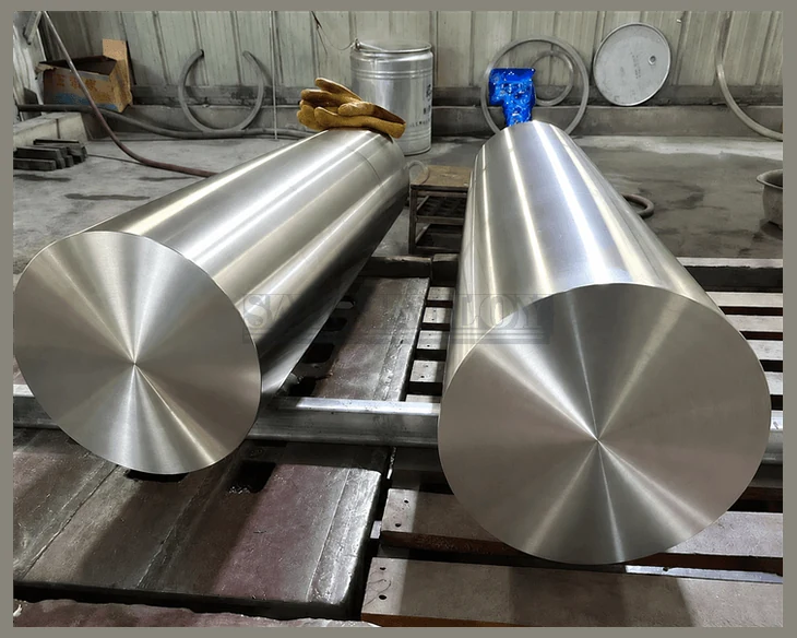 Two tapered titanium forged bars on a machine bed