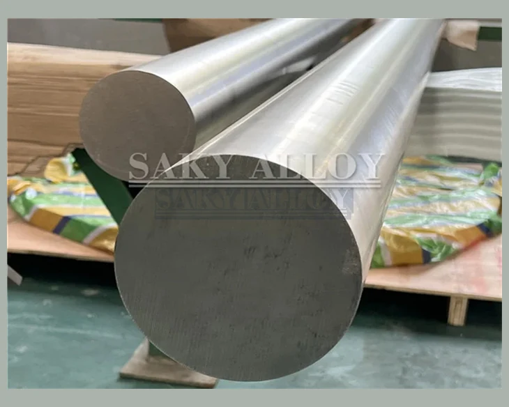 Three large-diameter titanium round bars with machined ends
