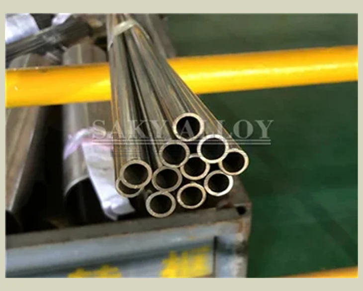 Small-bore titanium tubes bundled beside a production line